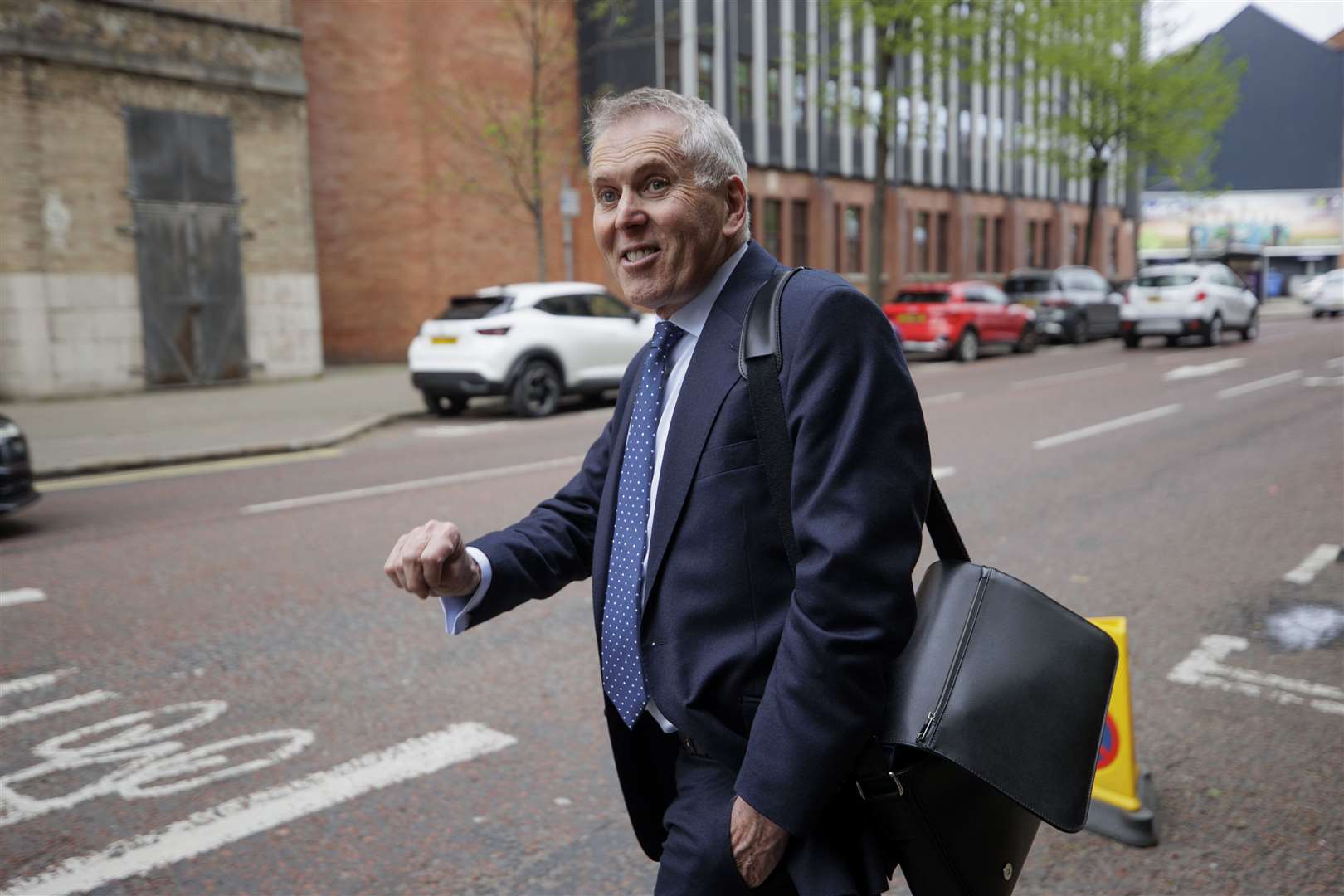 Sir David Sterling leaves the Clayton Hotel in Belfast after giving evidence at the UK Covid-19 Inquiry (Liam McBurney/PA)