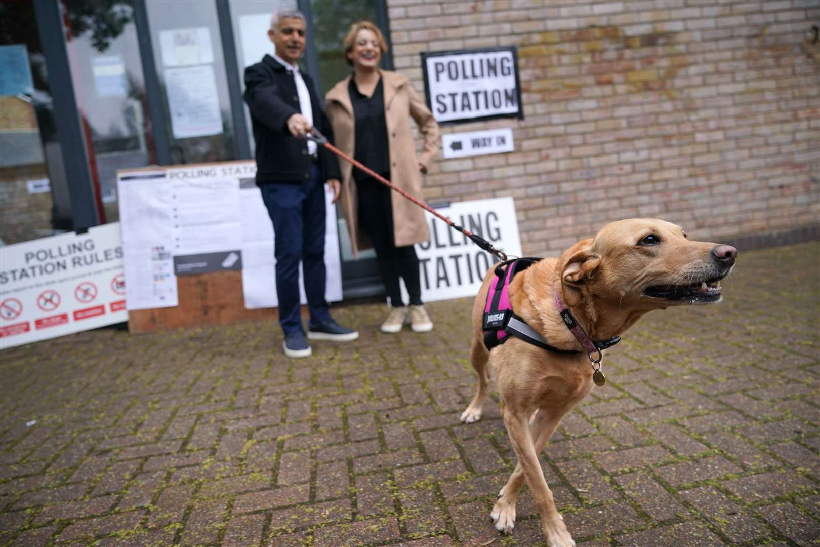 Sadiq Khan with his wife Saadiya Khan and dog Luna visited a polling station in south London (Yui Mok/PA)