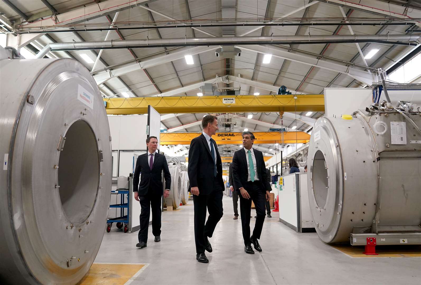 The Prime Minister (right) and the Chancellor (left) were shown around the Siemens Healthineers factory (Jacob King/PA) 