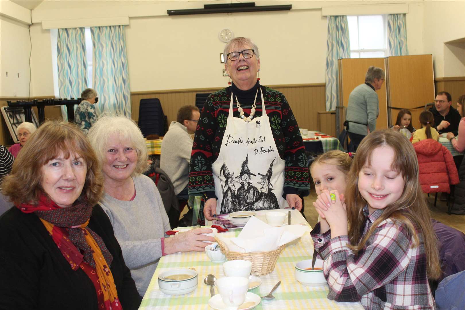 Happy customers Eileen Roberston, Eunice Naysmith, Alba and Isabelle Robertson were served by Val Reid at Saturday's soup 'n' sweet event in St Andrews church hall, High Street, Inverurie. Picture: Griselda McGregor