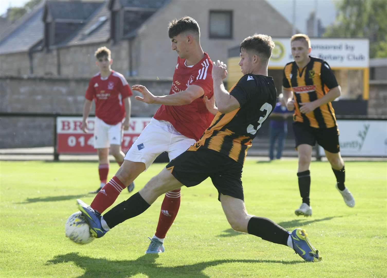 Huntly's Lyall Booth trying to stop Deveronvale's Max Stewart. ..Huntly FC v Deveronvale FC...Picture: Beth Taylor.