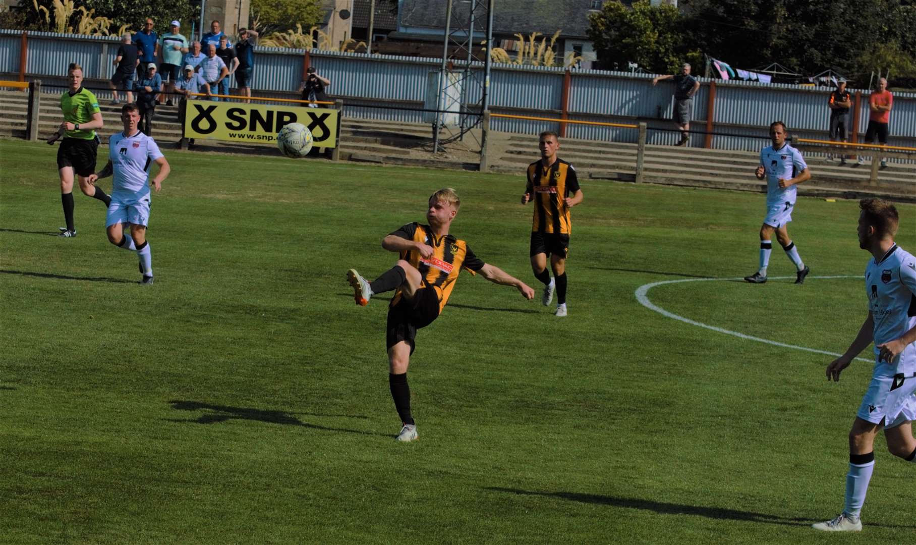 Adam Morris makes a clearance for Huntly. Picture: Derek Lowe