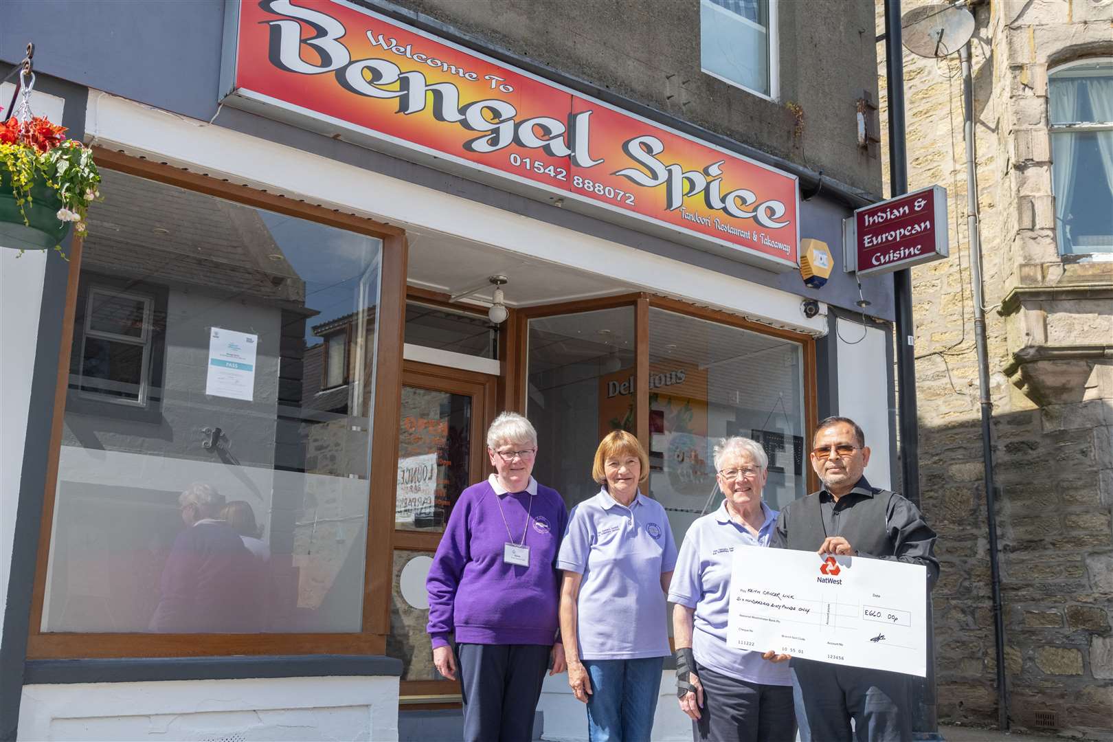 From left: Karen Simpson, Isobel Sadowski and Adeline Reid from Keith Cancer Link receiving a cheque for £660 from Abdul Aziz, owner of Bengal Spice...Picture: Beth Taylor.