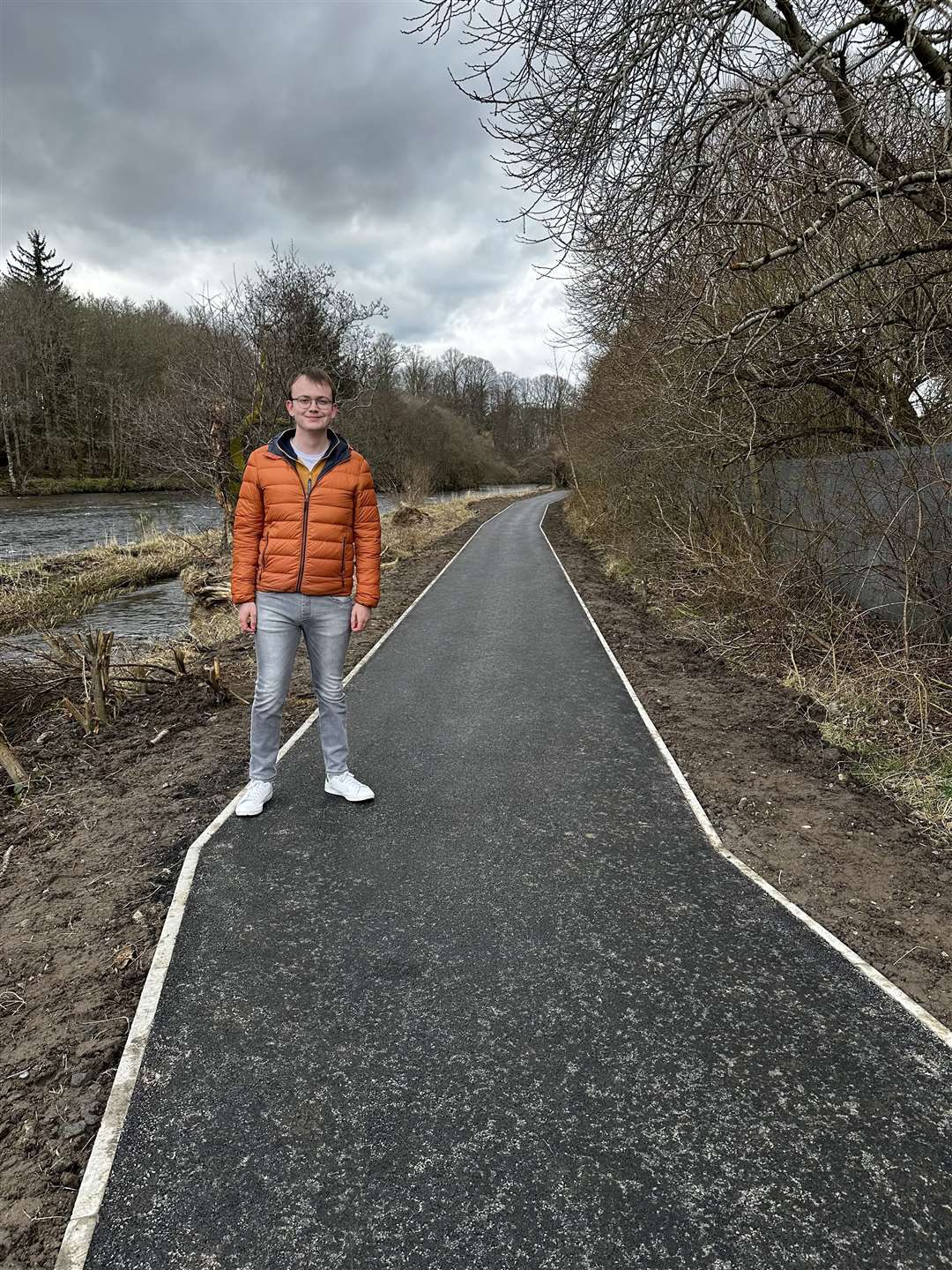 Councillor Sam Payne at the newly repaired footpath.