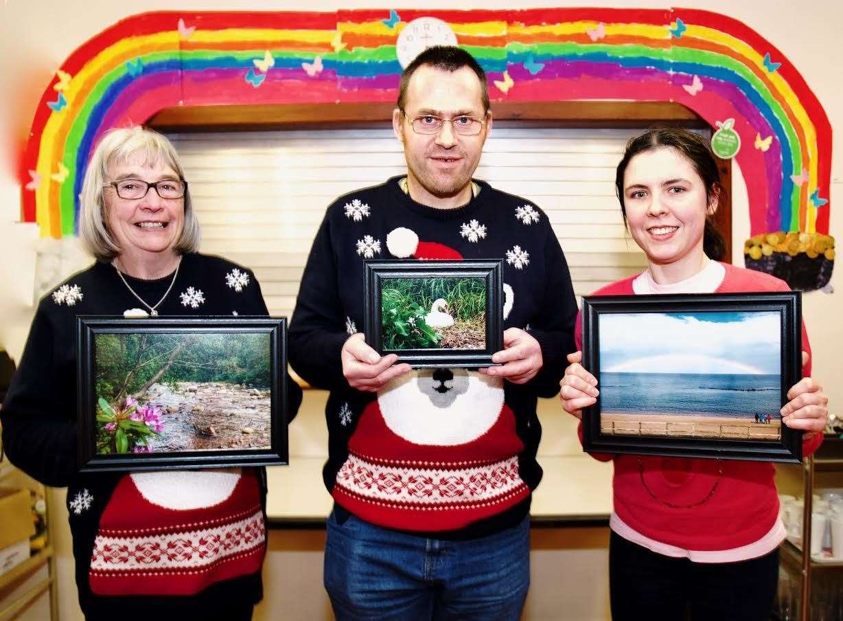 Winners Patsy, Peter and Charlotte with their photographs. Picture: Phil Harman