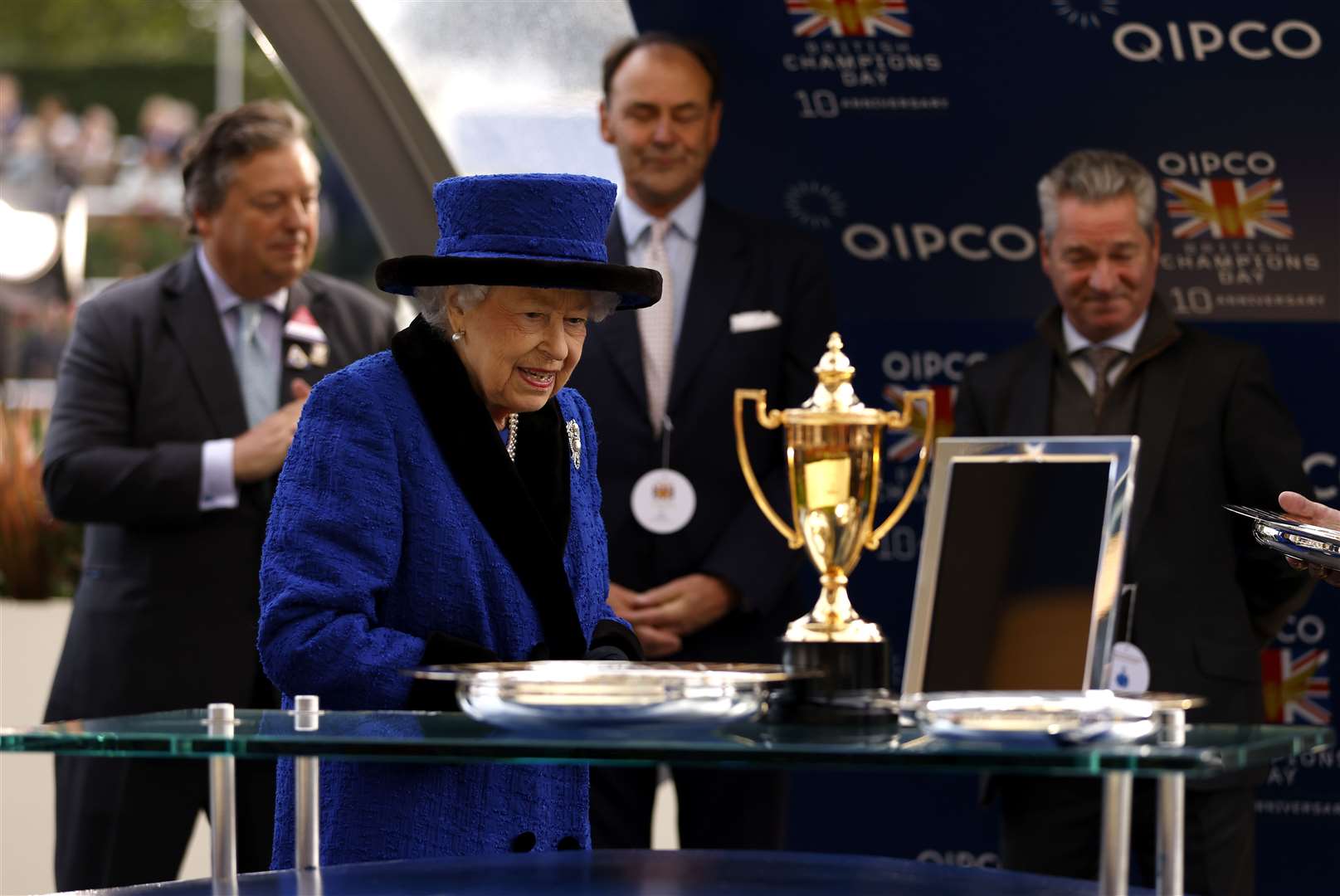 The Queen ahead of presenting the trophy after the Queen Elizabeth II Stakes (Steven Paston/PA)