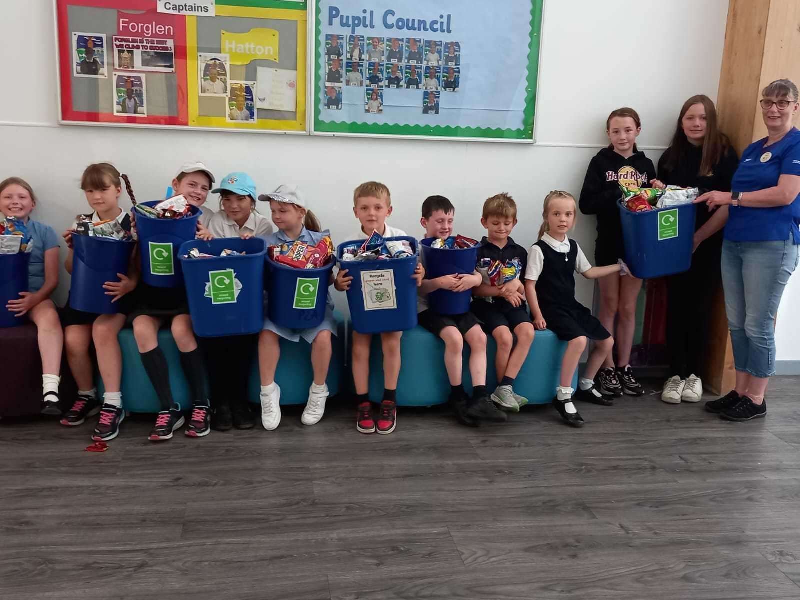 Turriff primary handed over thousands of crisp packets which will now be recycled through Tesco