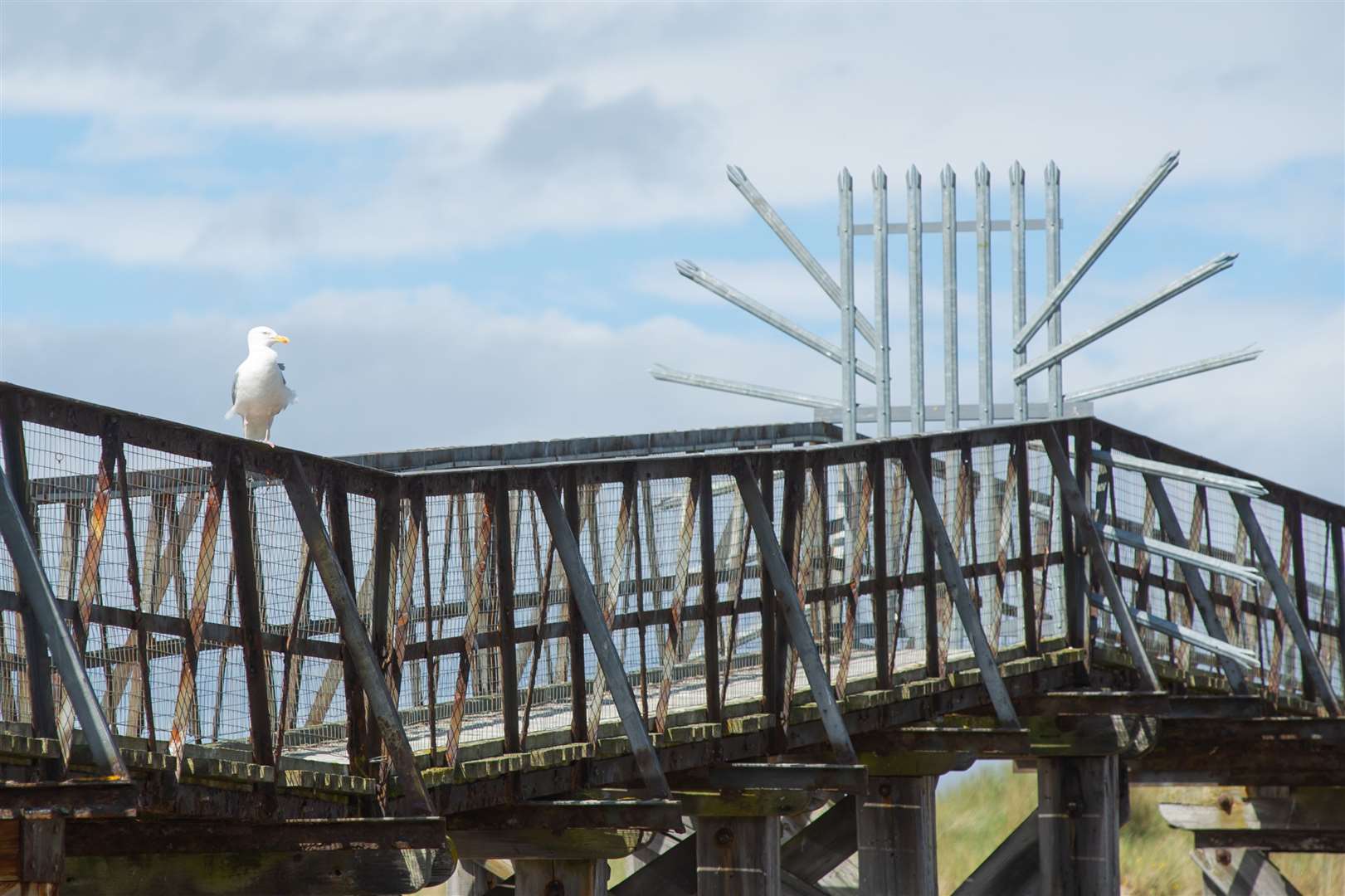 Moray Council has now installed palisade fencing on Lossiemouth's East Beach footbridge to prevent attempts to cross the dangerous structure after previous fencing and chains were moved. Picture: Daniel Forsyth.