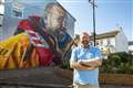 RNLI volunteer honoured for 40 years of service with mural looking out to sea