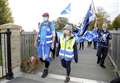 Scottish independence supporters march into Elgin