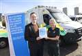 Charity presents ambulance service with treatment guide for Parkinson's patients 