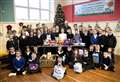 Cluny kids help make Christmas real for needy with food bank donation