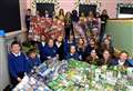 'It is vital that children are shown how they can help those in need': Primary school kids donate survival blankets to local charity