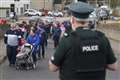 Football club leads solidarity march for shot PSNI officer