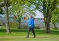 Keith Golf Club member walking marathon around 18th green