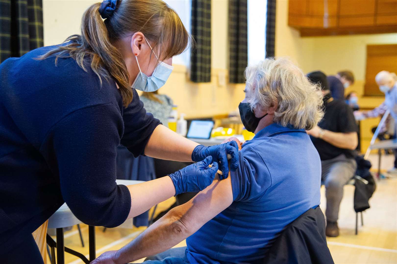 Karen Law administers the vaccine at the Stewart's Hall, Huntly. Picture: Daniel Forsyth.