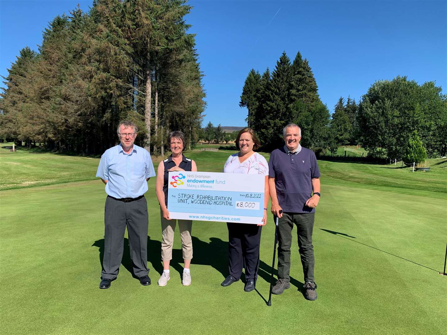 Insch Golf Club members Alan Donald, Eileen Gerrard and Robert Ingram present the donation to Therese Lebedis.