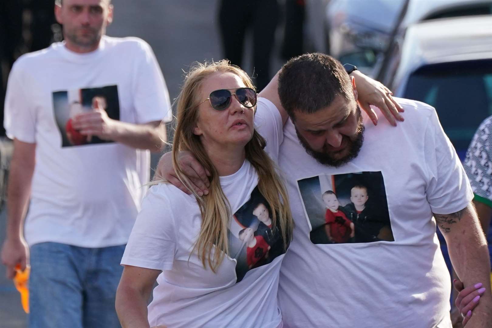 People wore T-shirts with the faces of the two teenagers to pay tribute (Jacob King/PA)