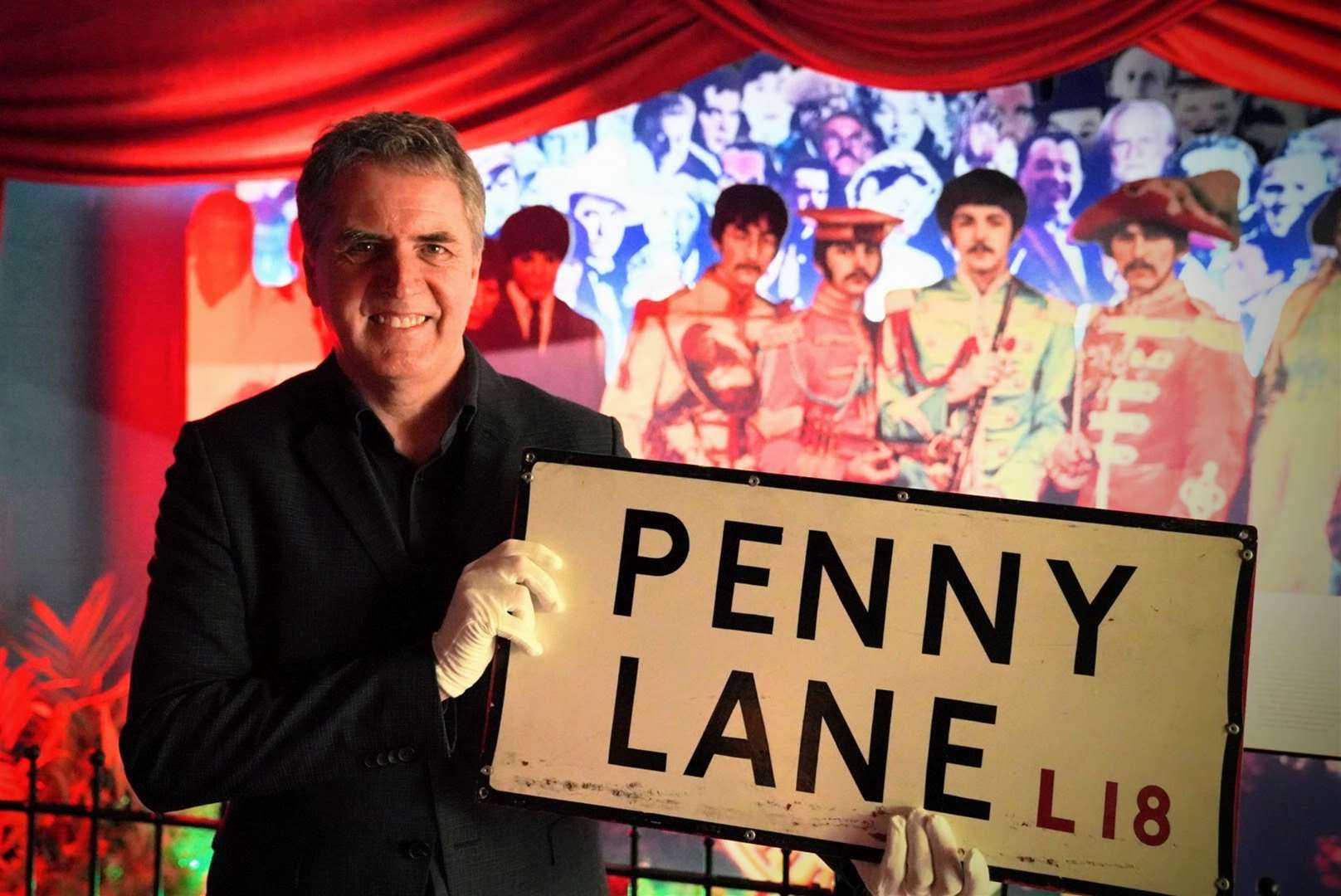 Mayor of Liverpool City Region Steve Rotheram holding the now returned Penny Lane street sign (Kevin Matthews/PA)