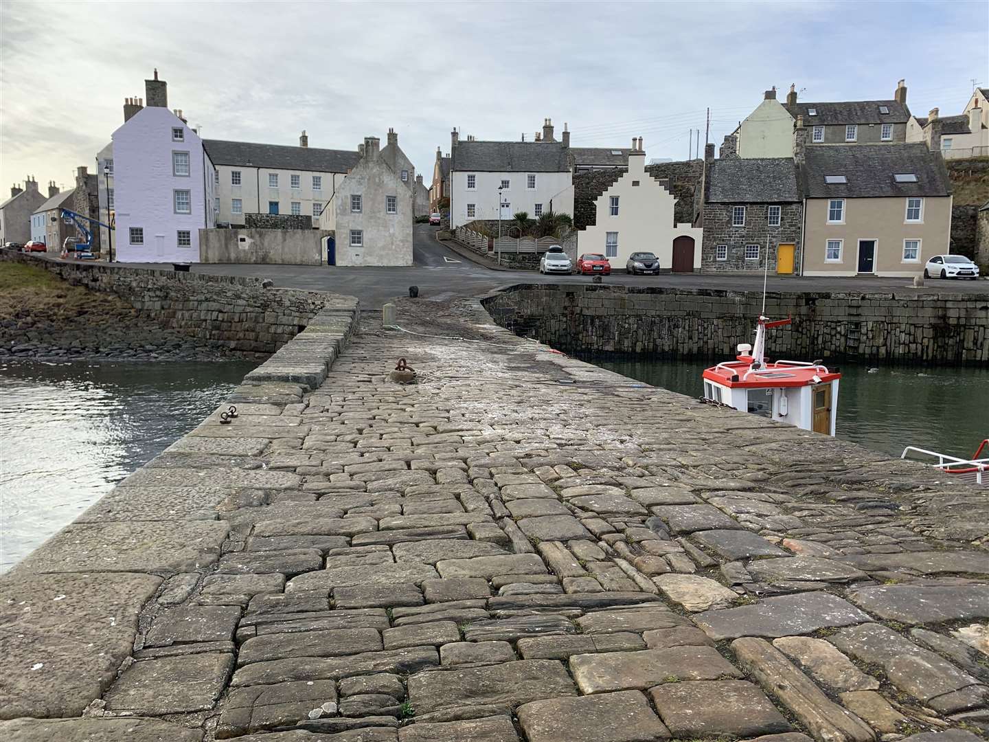 Portsoy Harbour is firmly back in the North East of Scotland once more after briefly undergoing its Peaky Blinders transformation. ..Photograph by Daniel Forsyth.