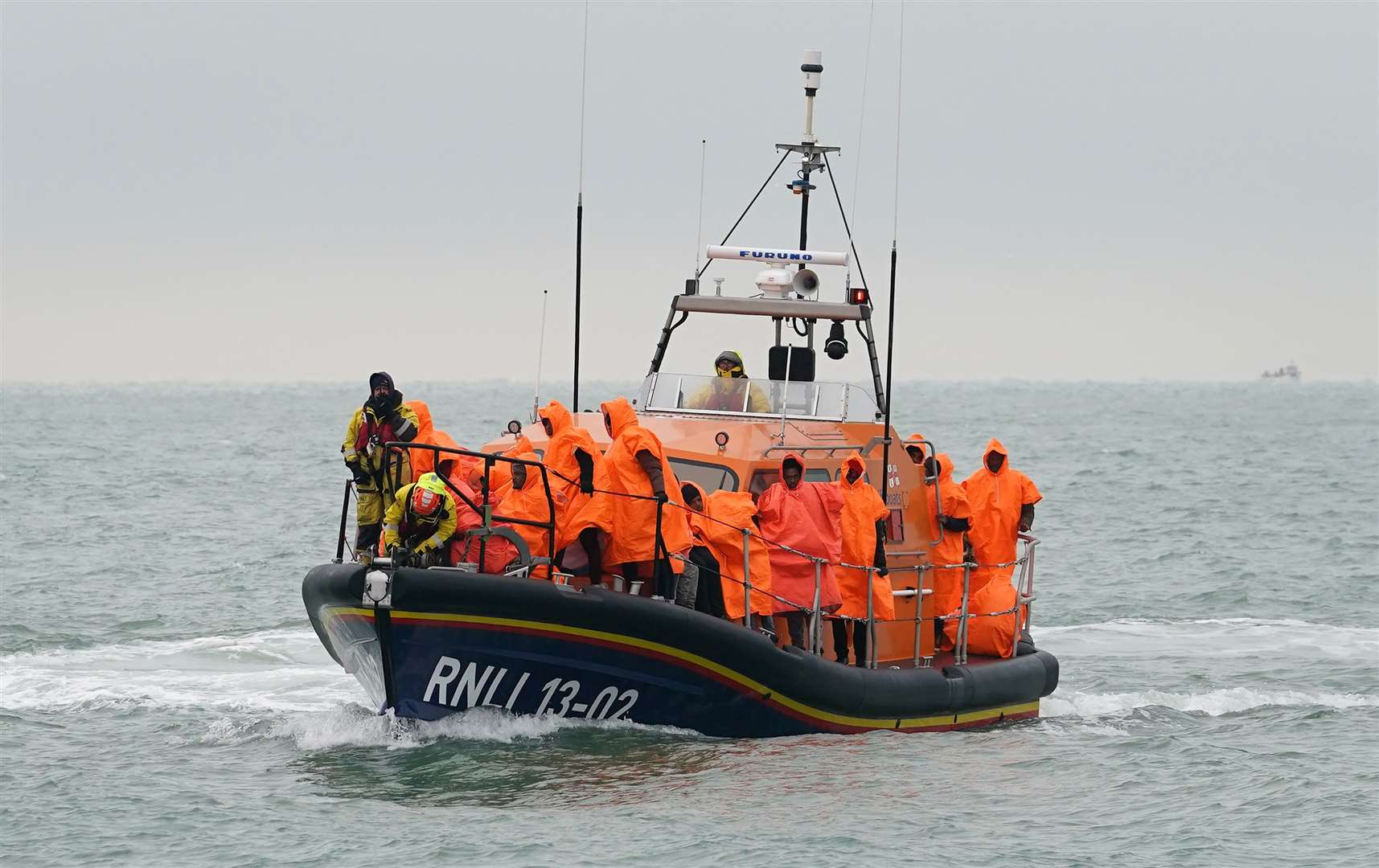 A group of people thought to be migrants are brought in to Dungeness, Kent, after being rescued by the RNLI (Gareth Fuller/PA)