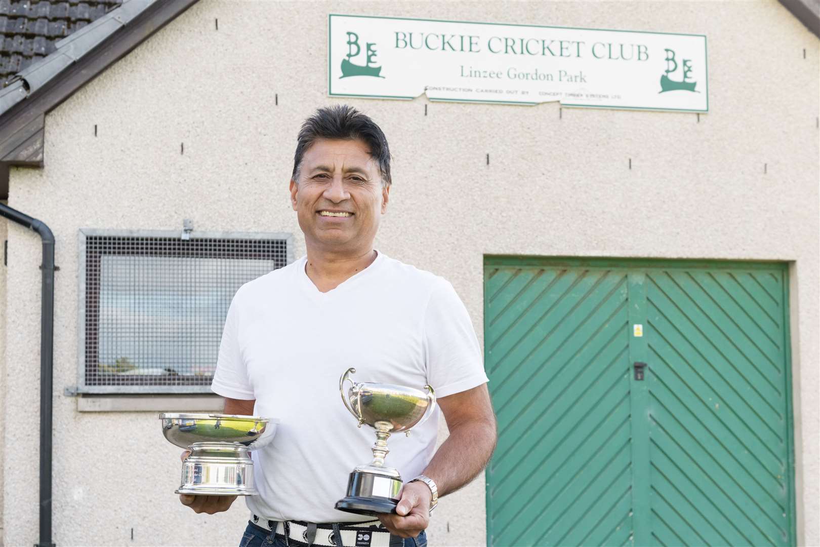 Buckie Cricket Club's Development team captain Tahir Shakeel proudly shows off the the league and Development Cup trophies. Picture: Beth Taylor