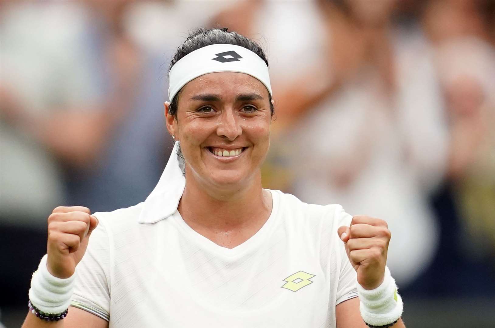 Ons Jabeur celebrates victory over Aryna Sabalenka in the semi-finals at Wimbledon (Victoria Jones/PA)