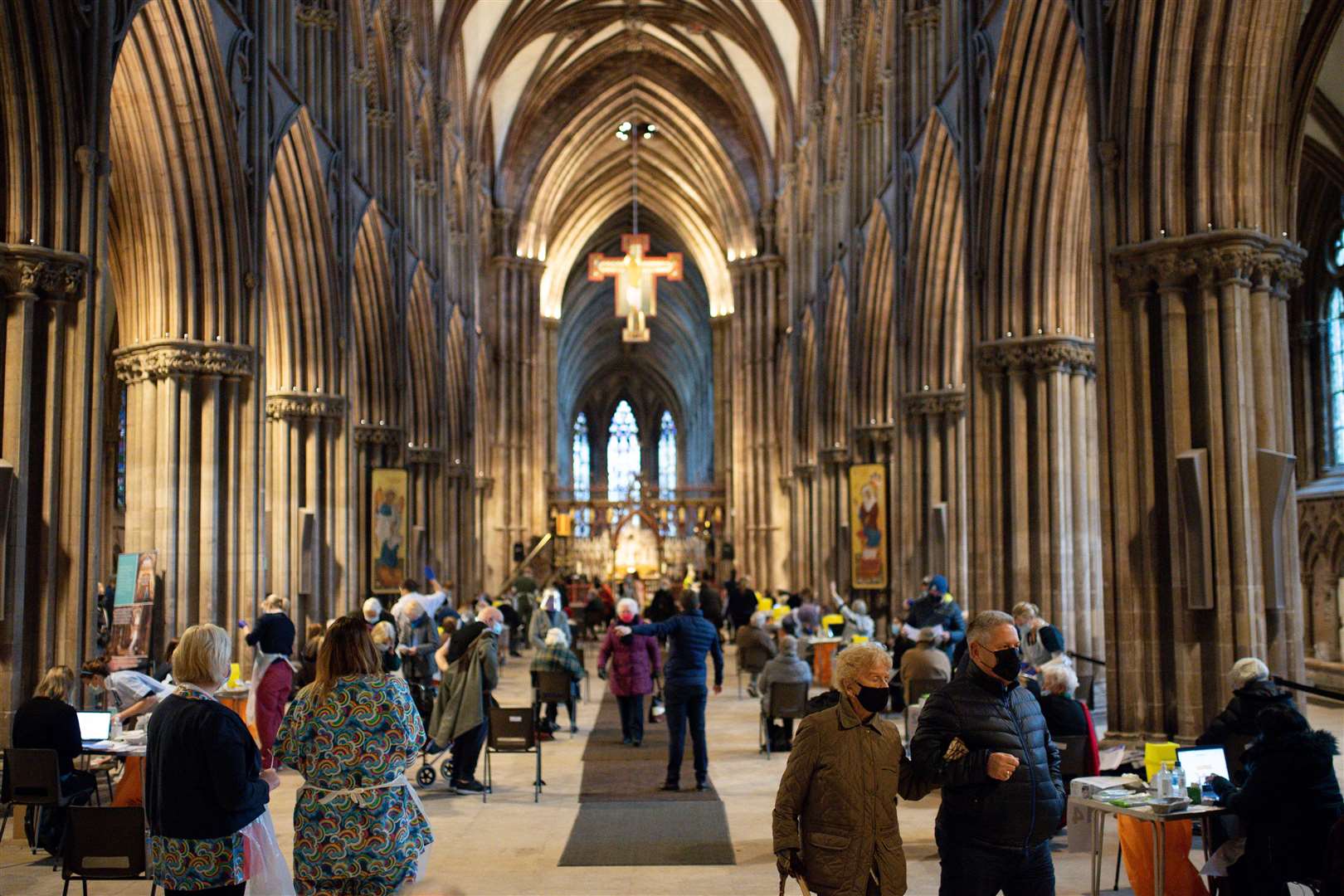 Members of the public at Lichfield Cathedral, Staffordshire, to receive the Oxford/AstraZeneca coronavirus vaccine (Jacob King/PA)