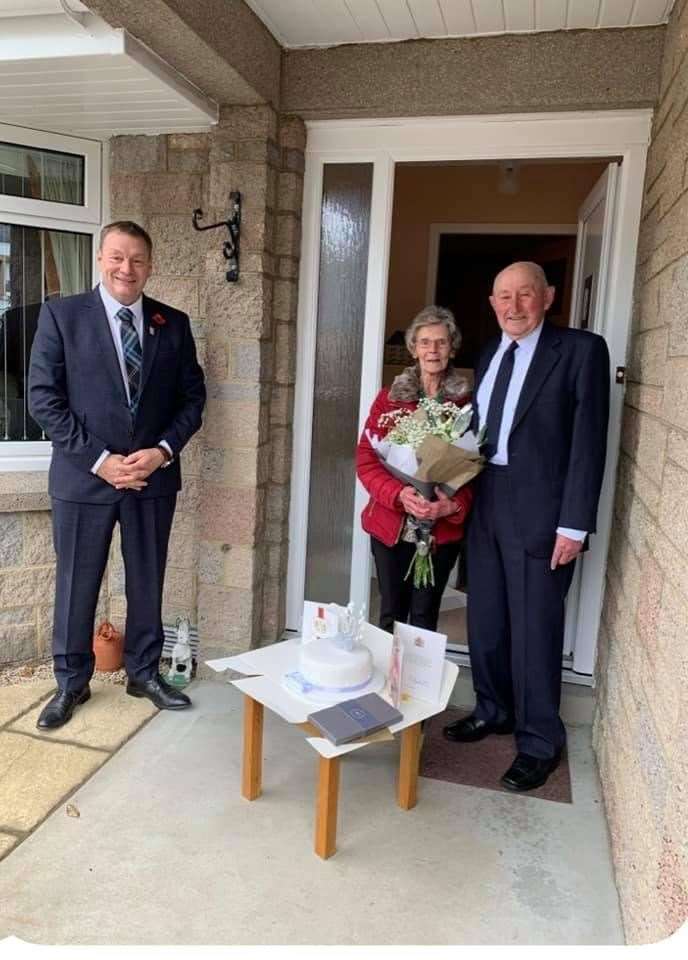 Deputy Lord Lieutenant of Banffshire Charles Milne congratulates Yvonne and Lewis Riddoch on their diamond wedding anniversary. Picture: Charles Milne