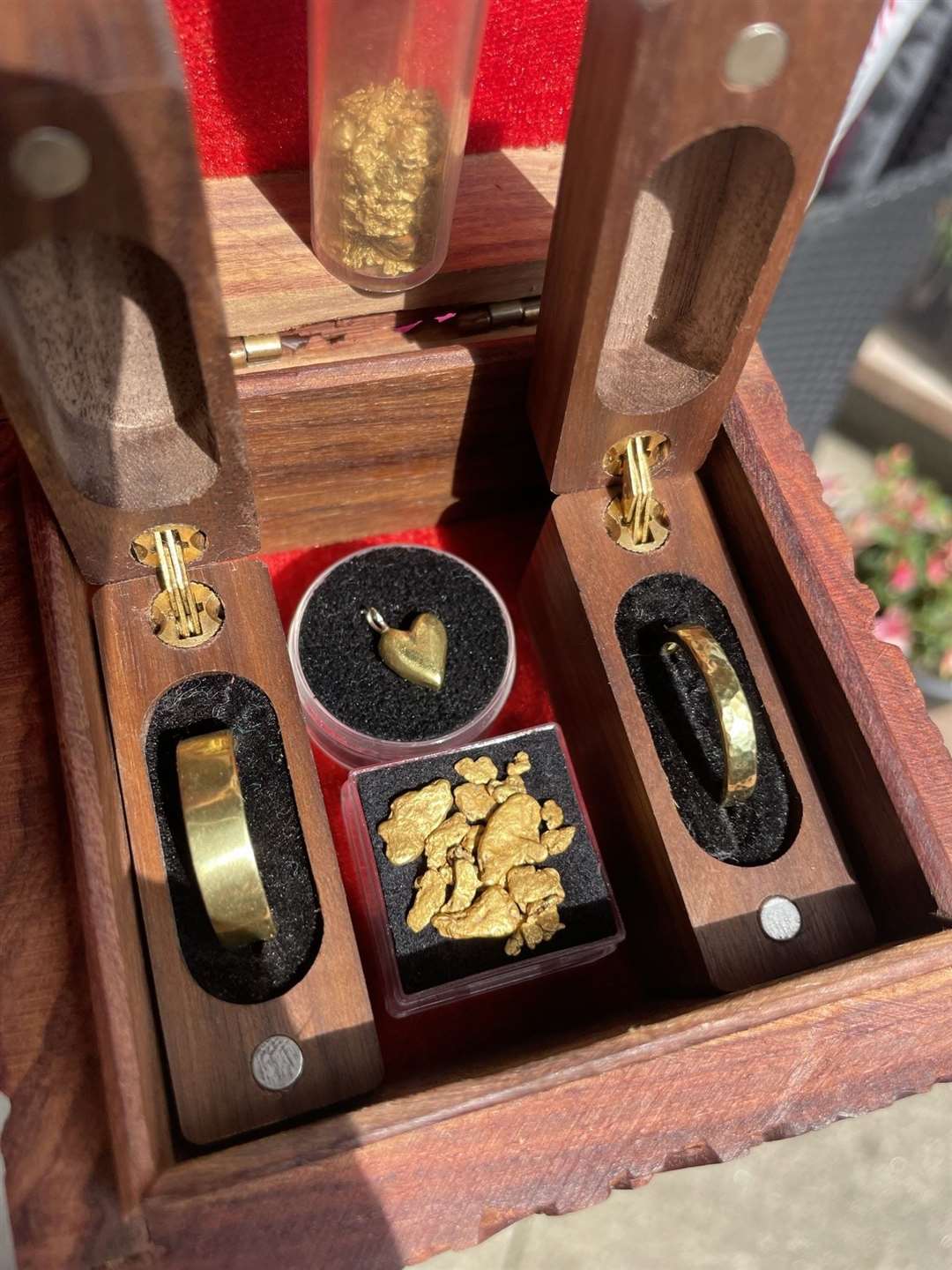 The gold rings and pendant Michael commissioned for his family.