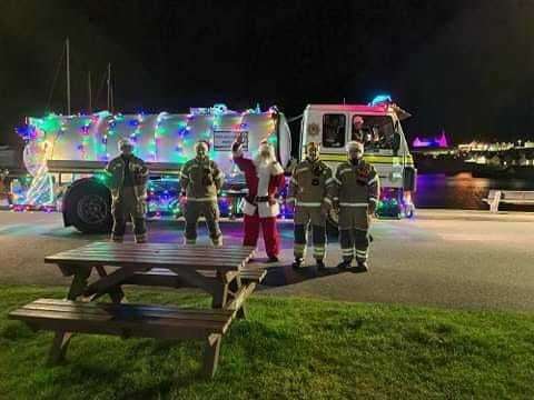 The Buckie crew give Santa a lift to Findochty during last year's street collection. Picture: Buckie fire station