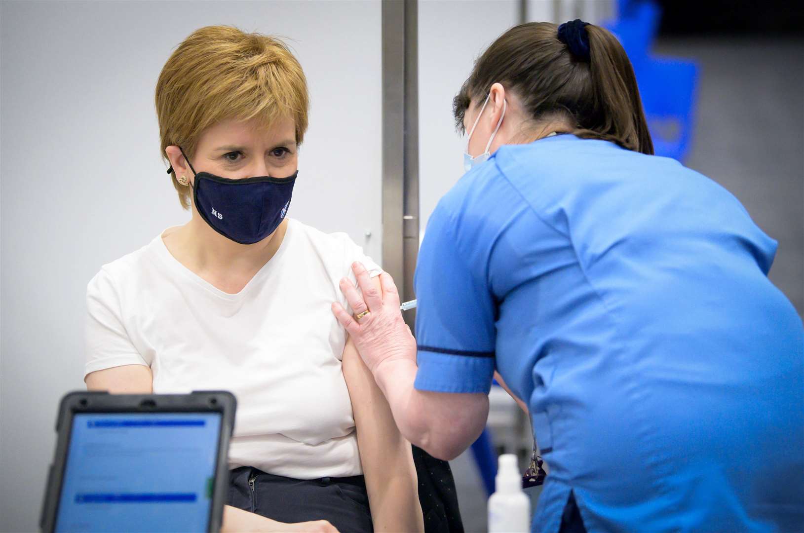 First Minister of Scotland Nicola Sturgeon receives her first shot vaccine (Jane Barlow/PA)