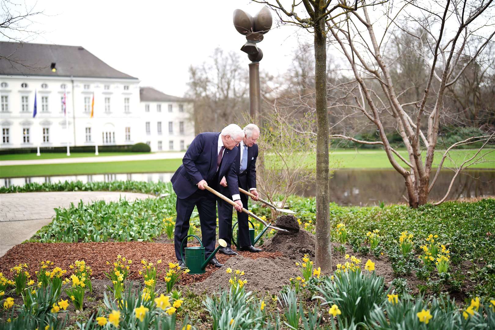The King and German President Frank-Walter Steinmeier plant a tree after attending a Green Energy reception at Bellevue Palace, Berlin, the official residence of the President of Germany (Ben Birchall/PA)