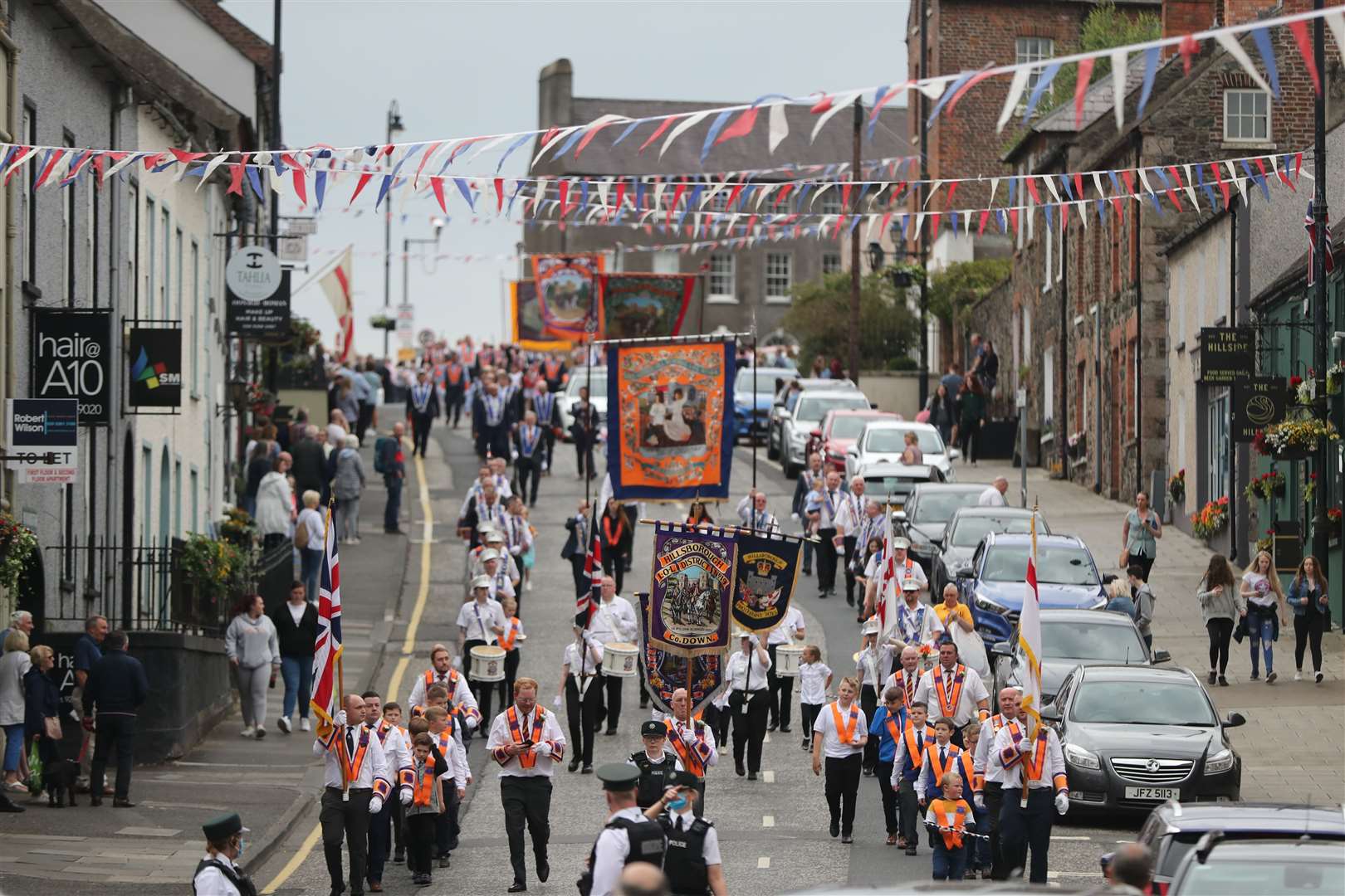 The Orange Order parade in the village of Hillsborough, Co Down, as part of the July 12 celebrations (Niall Carson/PA)