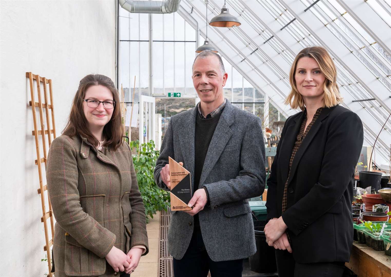 Overall winner of the Conservation and Building Adaptation category was The Vinery by GD Lodge Architects. Alec Milne is pictured receiving the award from Yvonne Tough and Victoria Grant of Aberdeenshire Council.