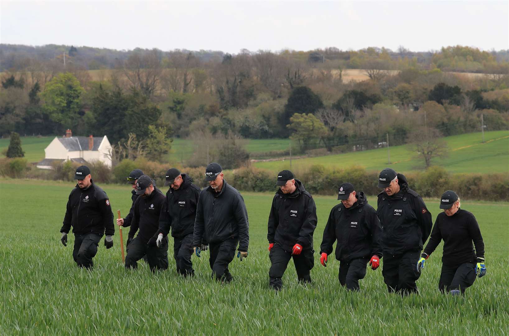 Police officers search fields close to the Kent hamlet of Snowdown (Gareth Fuller/PA)