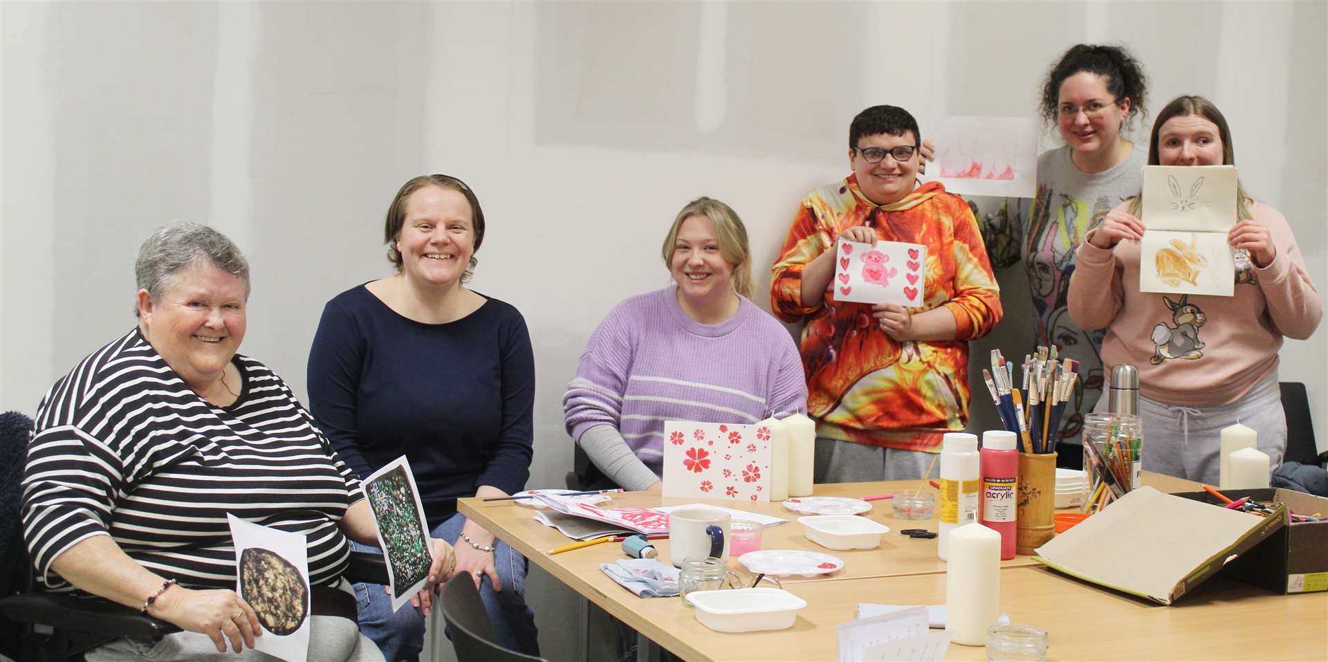 Arts and crafts students enjoyed a session of pillar candle decoration as well as making new friends at the creative hub at GO premises, West High Street, Inverurie with tutor Millie Farmer (right) and Emma Brew, community engagement therapy worker, Picture: Griselda McGregor