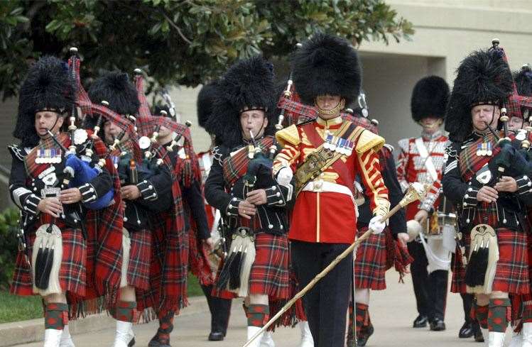 MPs are calling on the bearskins used for the caps worn by the Scots Guards to be replaced with faux fur.