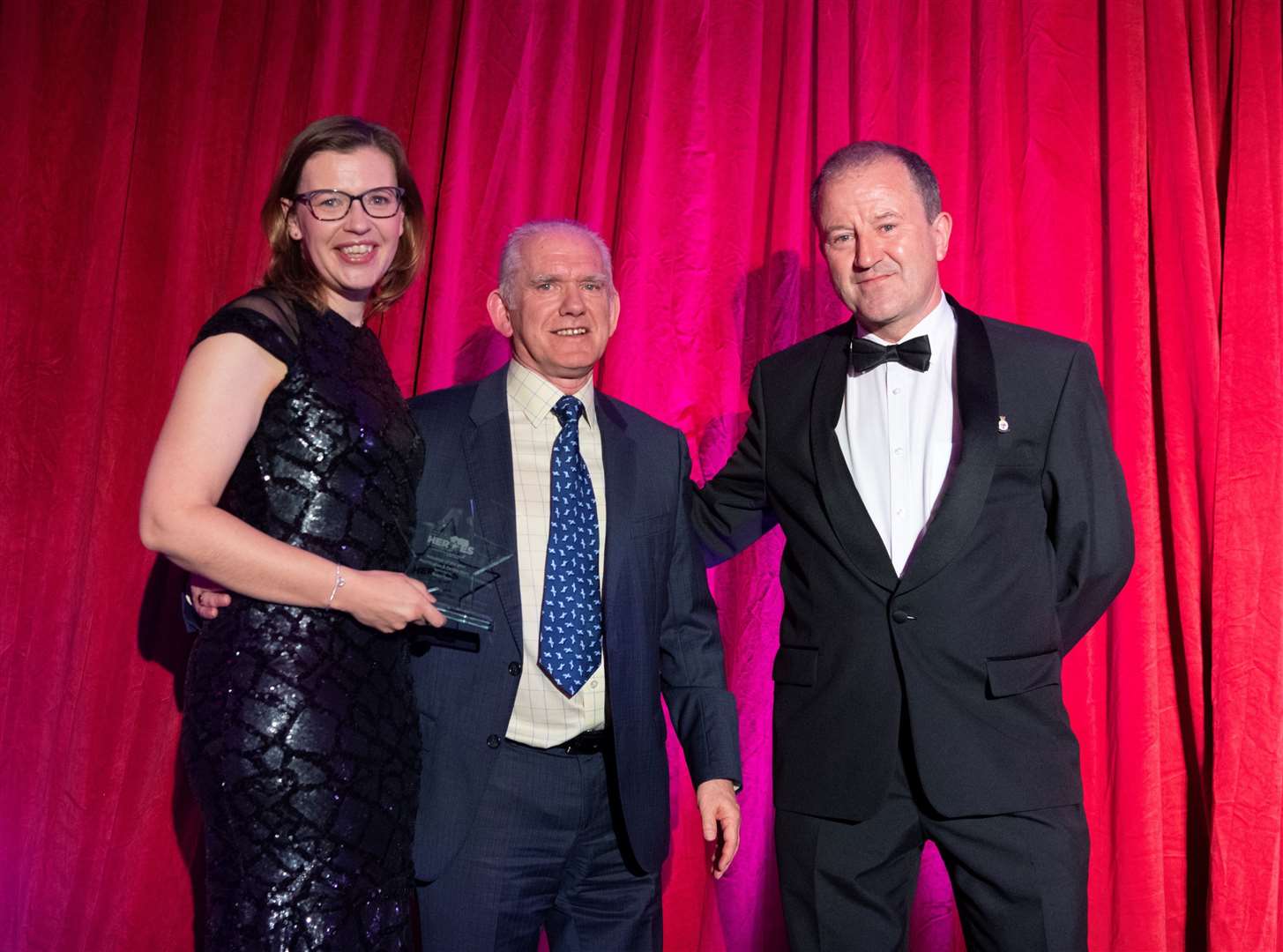 Volunteers of the year 2023, Debbie Main and Paul Hughes with Frank Reid (centre) managing director, Robertson Northern, award sponsor. Picture Beth Taylor