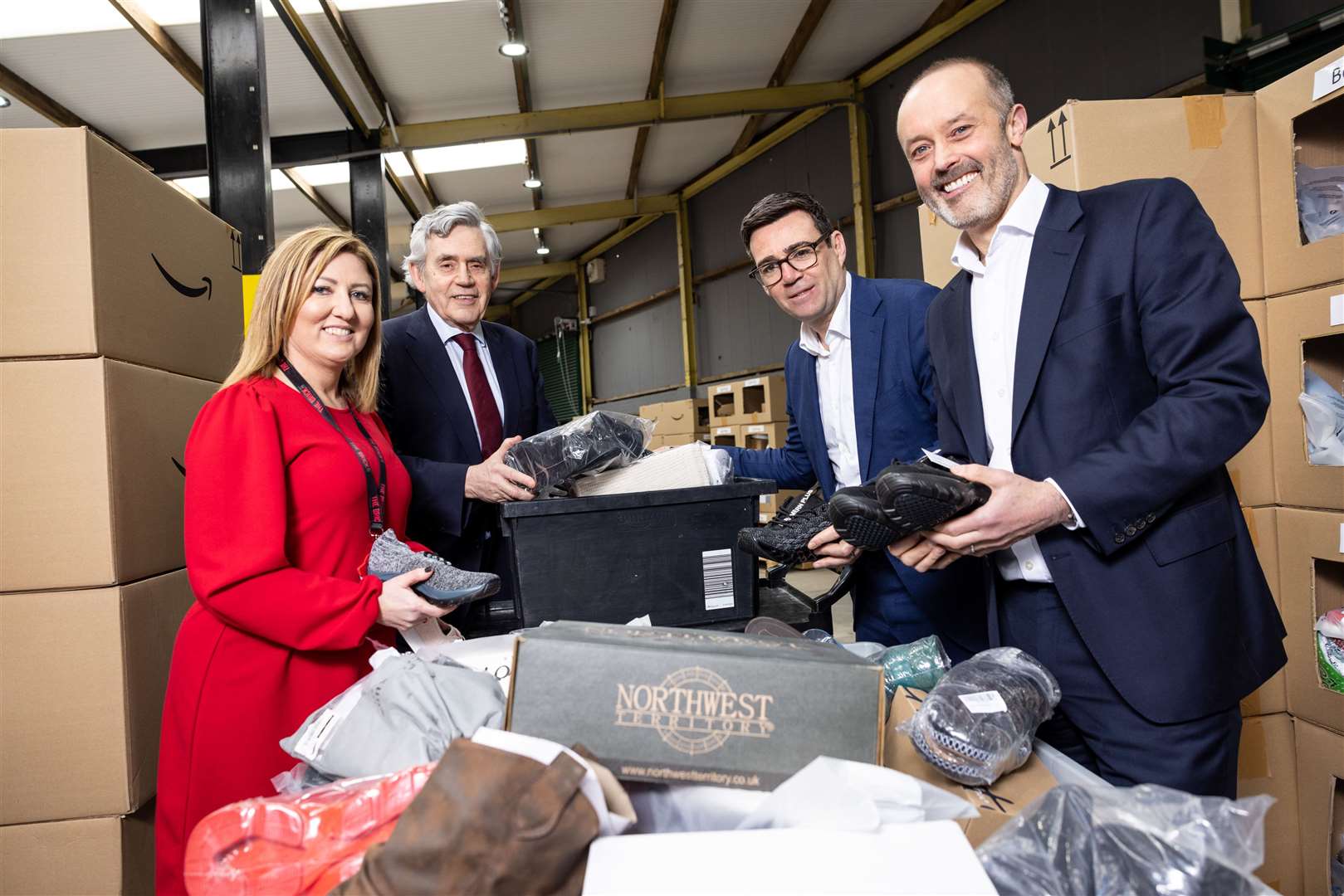 CEO of The Brick charity Keeley Dalfen, former PM Gordon Brown, Greater Manchester Mayor Andy Burnham and Amazon’s UK country manager John Boumphrey attend the launch of the scheme in Wigan (James Speakman/PA)