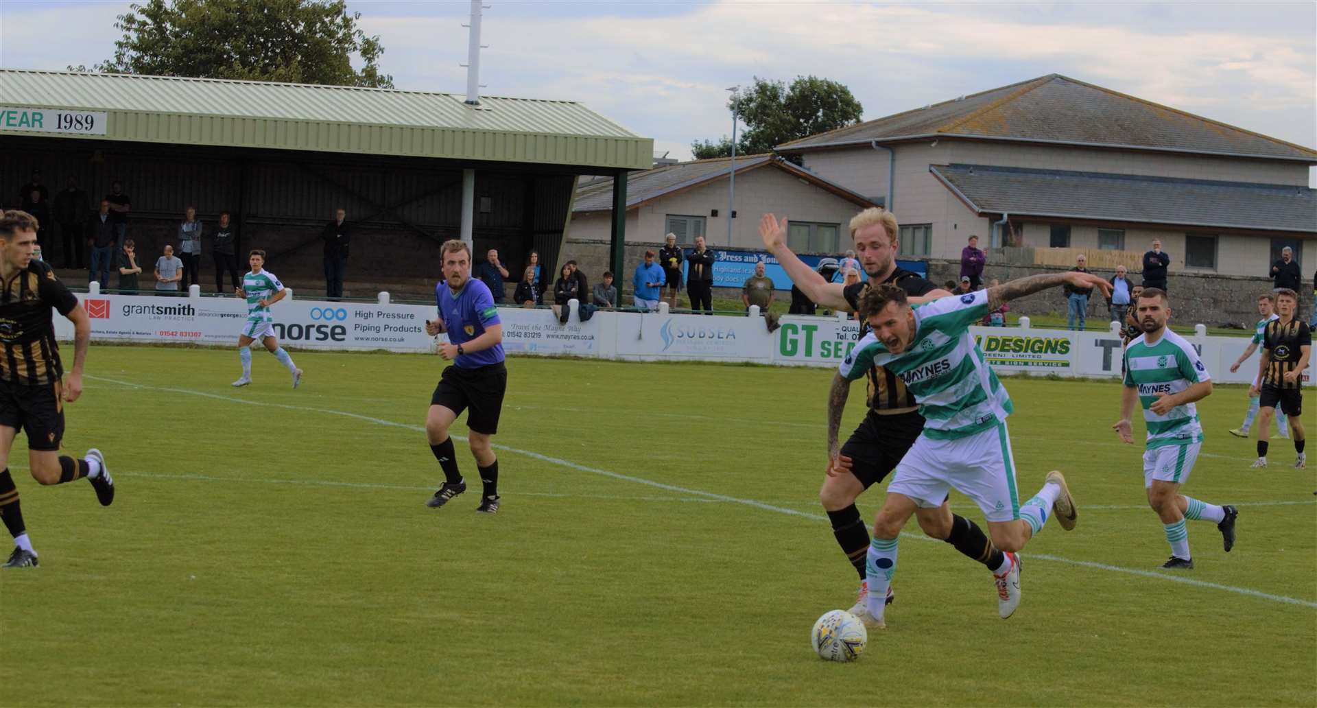 Ross Still battles for possession for Huntly. Picture: Derek Lowe