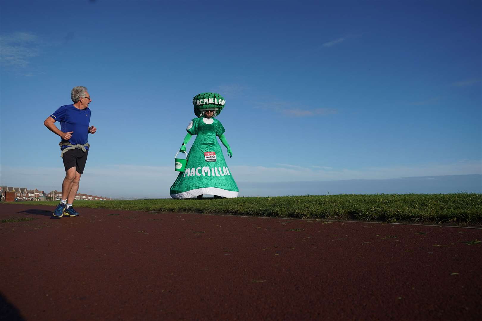 Runners including Colin Burgin-Plews, 52, of South Shields, taking part in costume in aid of cancer charity Macmillan, are undertaking the marathon on their own routes in the 2020 virtual event (Owen Humphreys/PA)