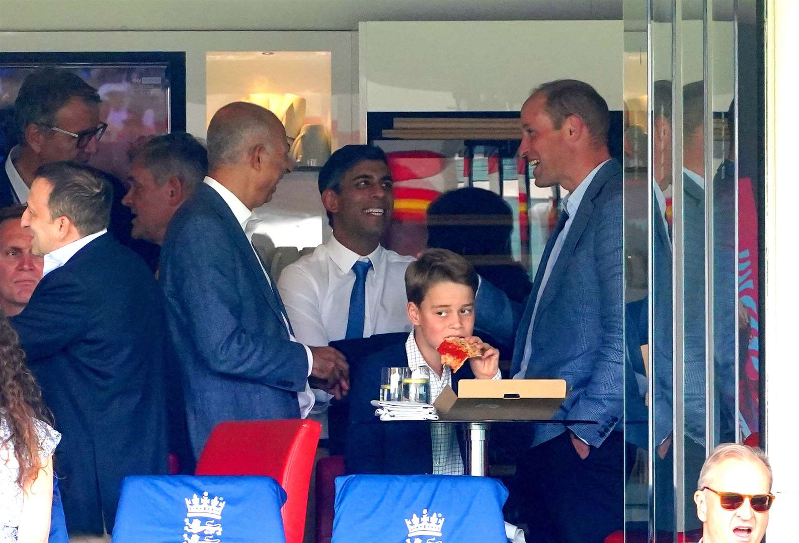 The Prince of Wales chatted to Prime Minister Rishi Sunak while Prince George enjoyed a slice of pizza at the cricket (Mike Egerton/PA)