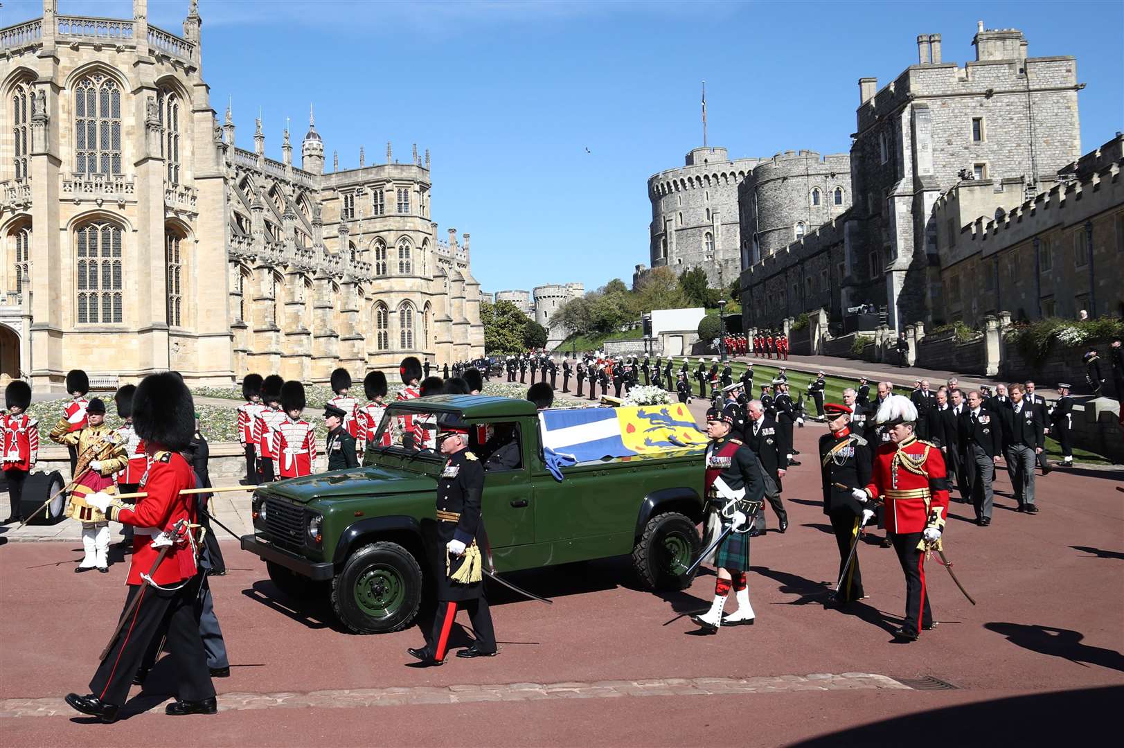 The Duke of Edinburgh’s coffin, covered with his personal standard, earlier travelled on the Land Rover Defender he helped design (Gareth Fuller/PA)