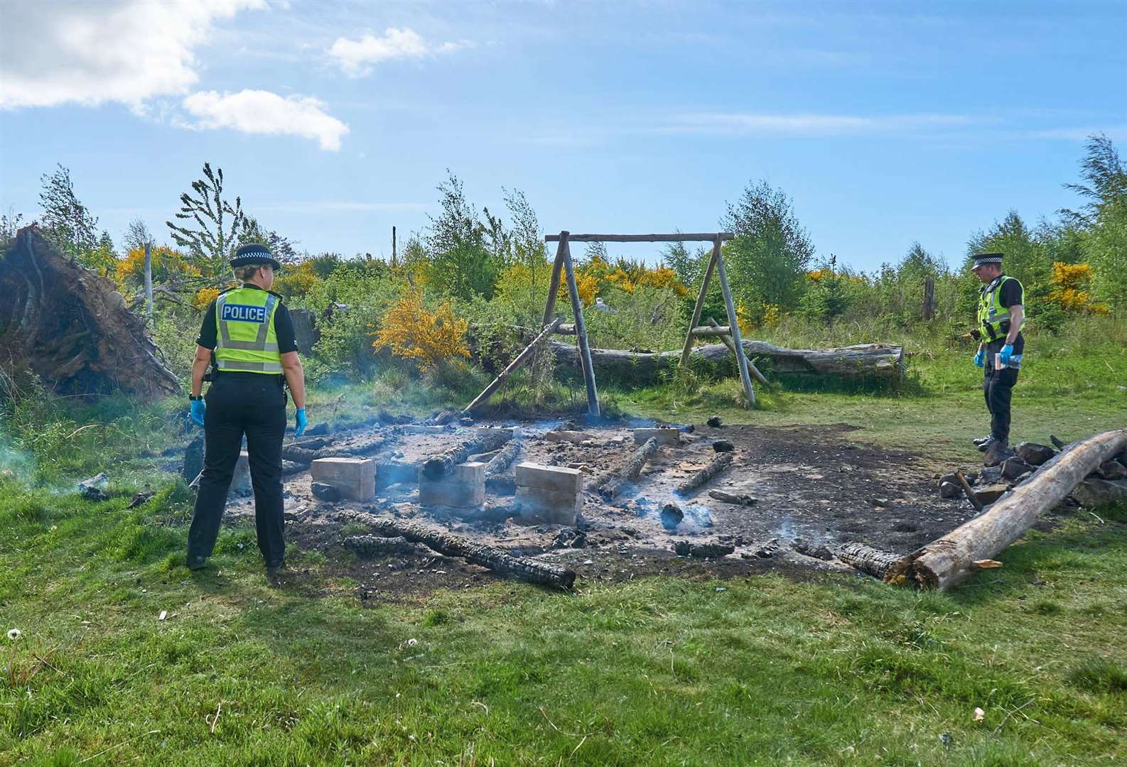 Police at the scene following the deliberate fire in May 2020.