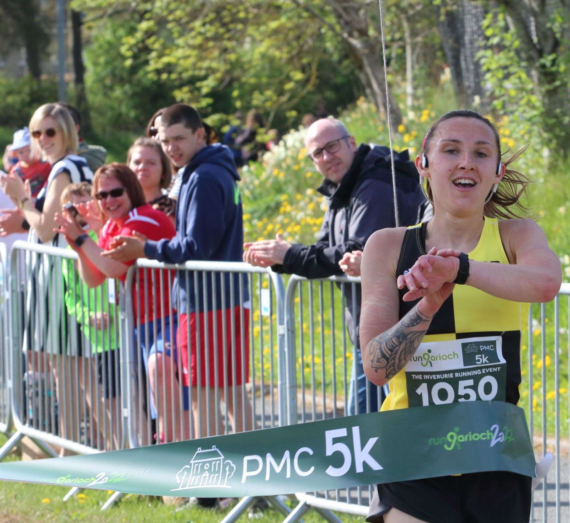 Metro Aberdeen's Chloe Gray crosses the line to take the ladies 5k title at Run Garioch 22. Picture: David Porter