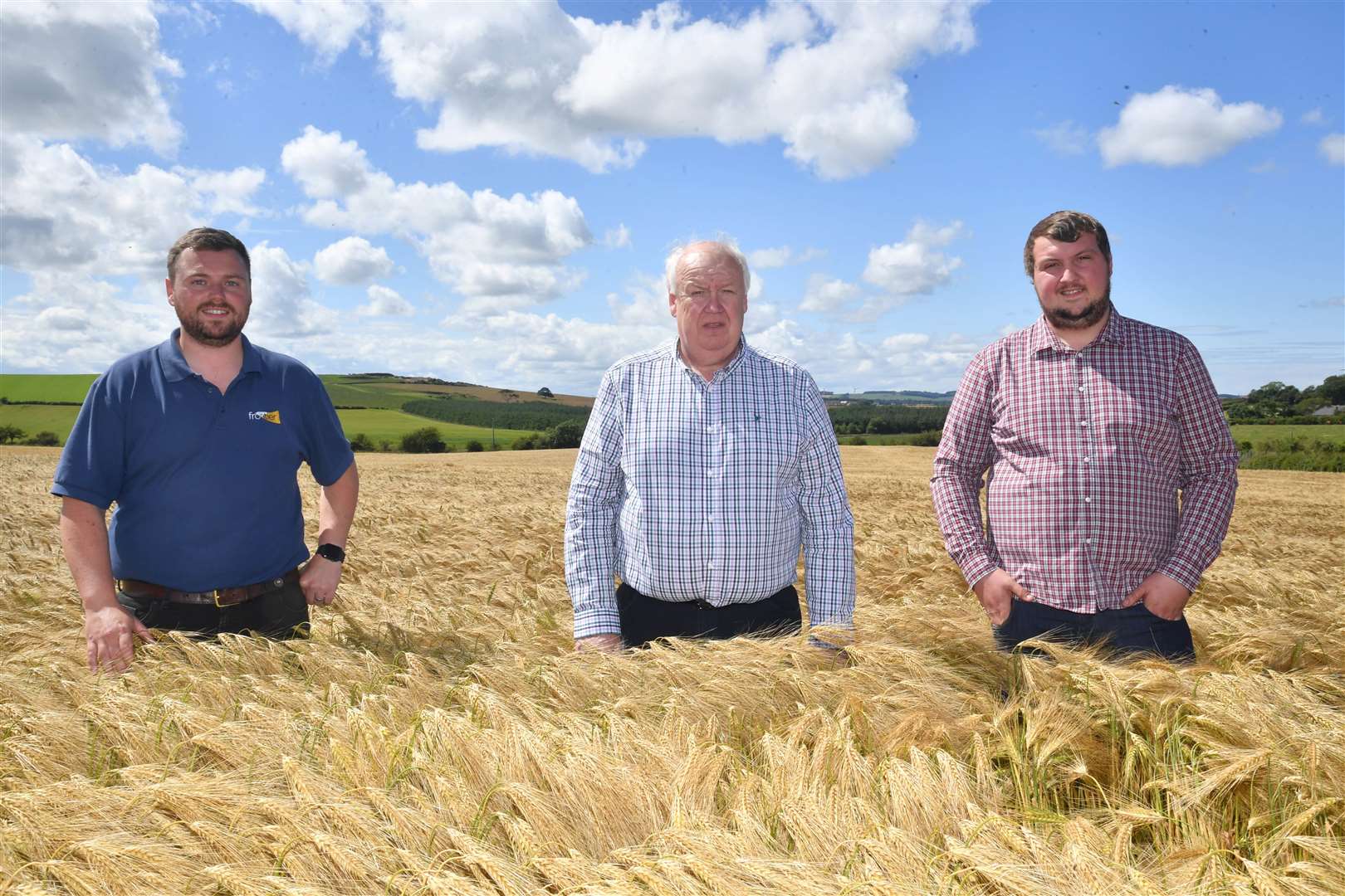 Steven Penrice from Frontier Agriculture with, David and Andrew Murphy in the prizewinning field of winter barley.