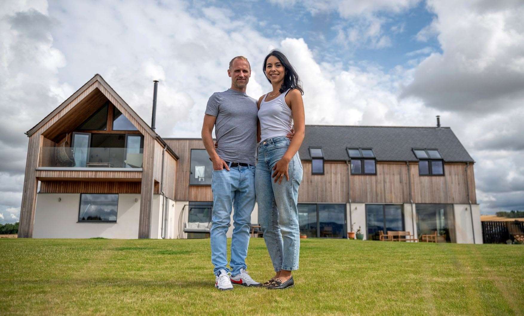 Homeowners Craig & Maria outside Casa Barra near Inverurie.,Casa Barra is a contemporary self-build barn-style dwelling situated on the site of a family farm. Home to Maria, Craig and their two children, Violeta and Matias, Casa Barra fits in with the rural landscape, making the most of the impressive views which surround. Picture: IWC Media,Michael Traill