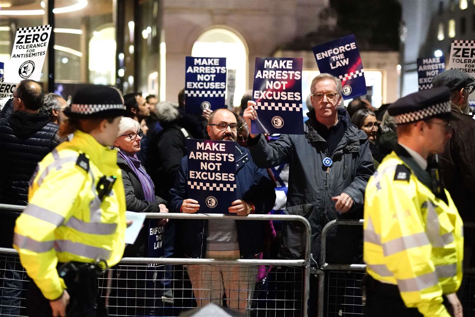 Campaigners holding up banners at the protest (Jordan Pettitt/PA)