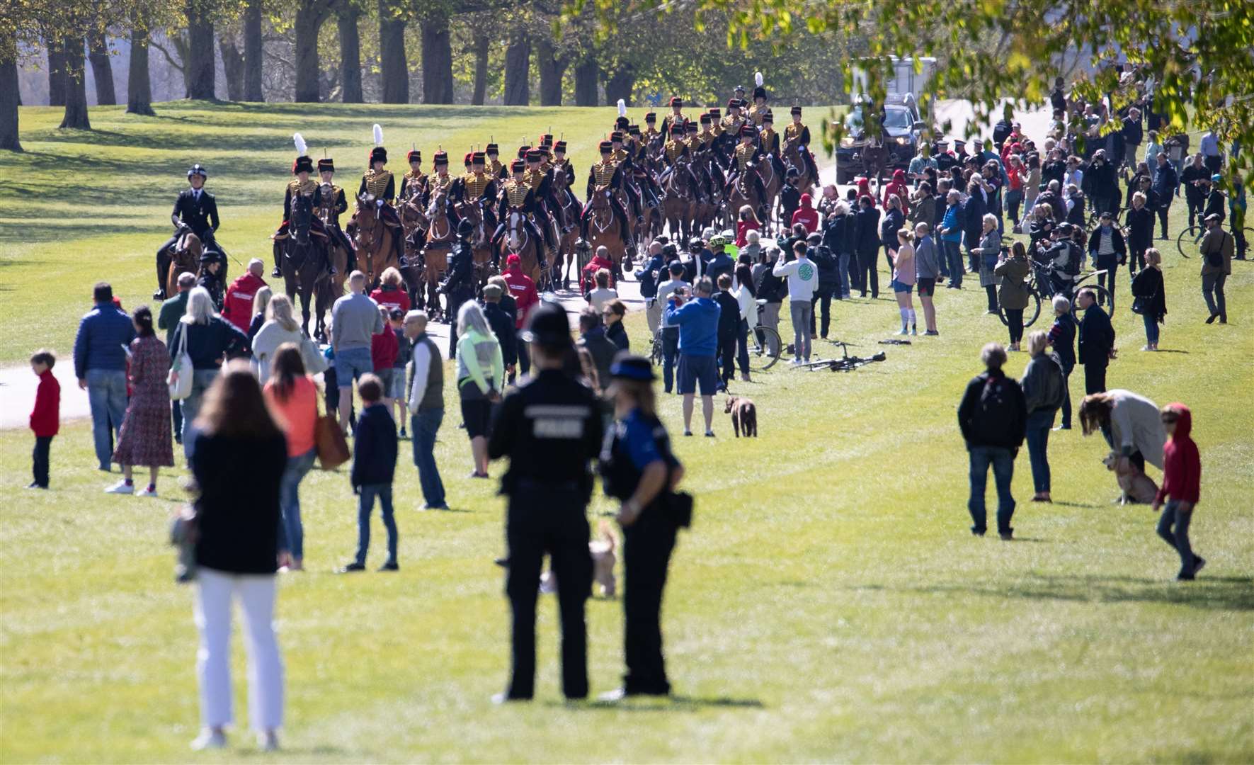 People gather on the Long Walk as the King’s Troop Royal Horse Artillery make their way towards Windsor Castle (Andrew Matthews/PA)